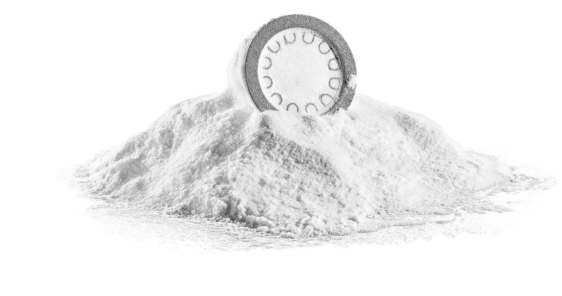 3D-printed component sitting on a mound of white 3D printing powder