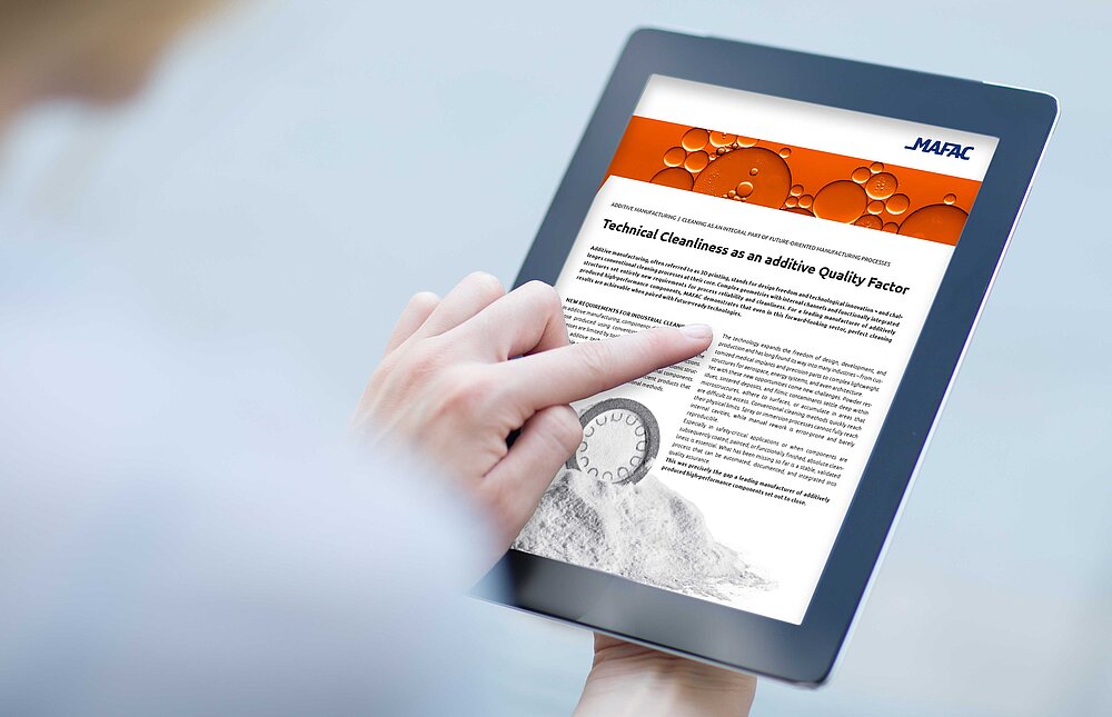 Close-up of a finger pressing on the touchscreen of a digital tablet