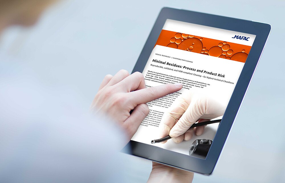 Close-up of a finger pressing on the touchscreen of a digital tablet